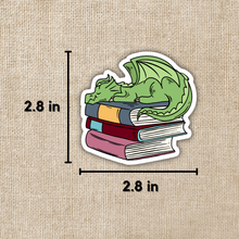 Load image into Gallery viewer, Dragon Sleeping on Book Pile Sticker
